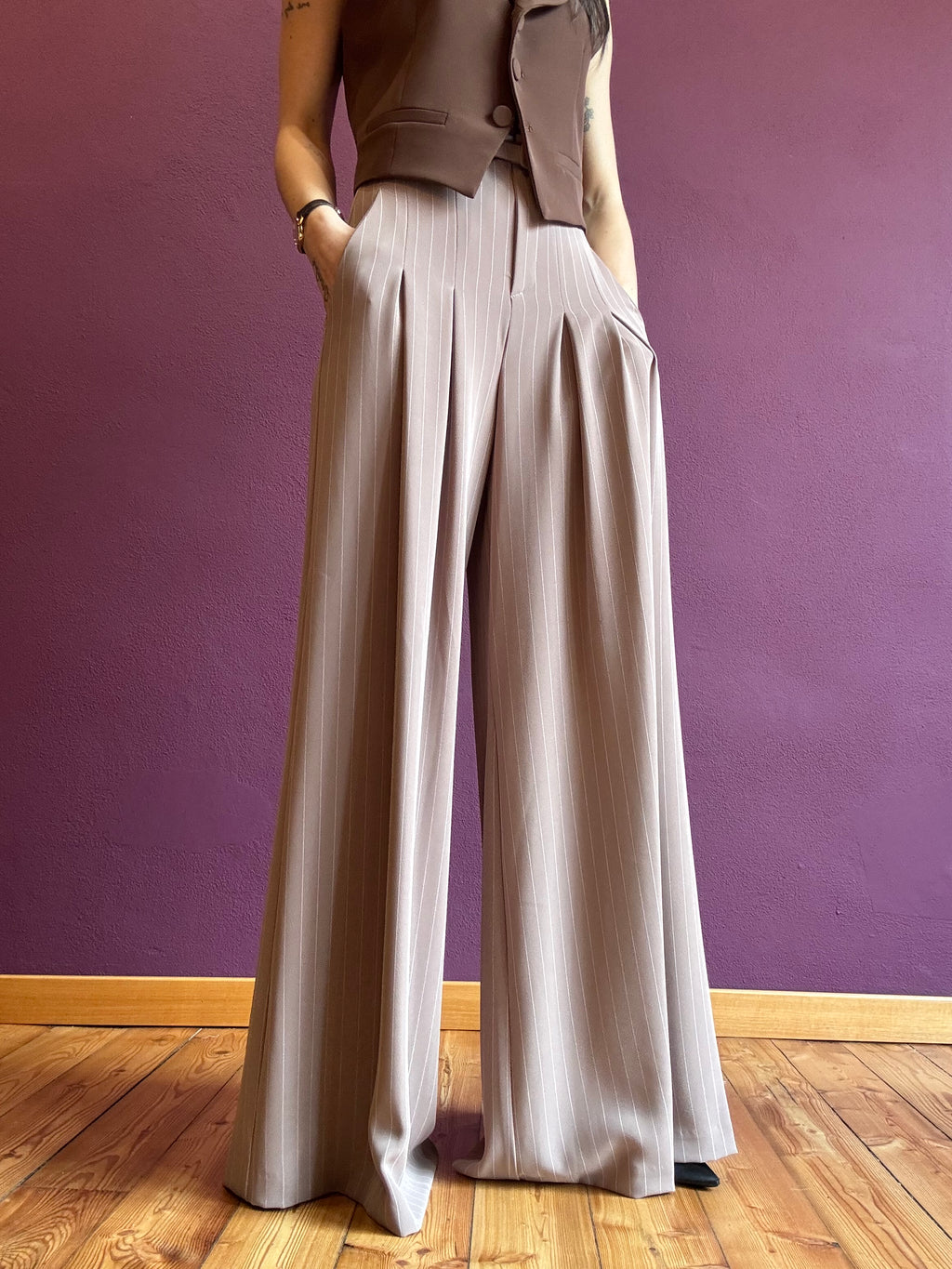 Pinstripe trousers with pleats and belt
