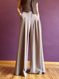 Pinstripe trousers with pleats and belt