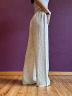 White linen-look trousers with elastic waist and lace drawstring