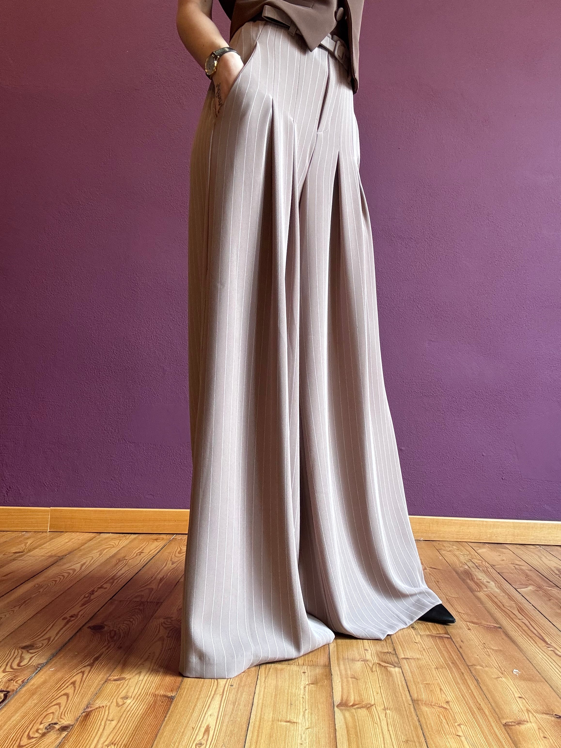 Pinstripe trousers with pleats and belt