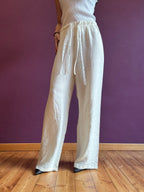 White linen-look trousers with elastic waist and lace drawstring